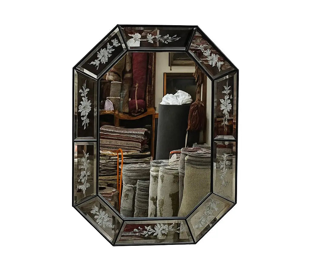Elegant vintage octagonal mirror featuring detailed floral etching on beveled glass panels. Approx. 25" x 29"