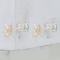 Sterling Silver Polished 4mm Round Light Blue CZ Stud Earrings