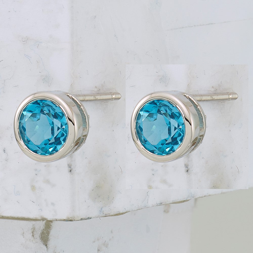 Sterling Silver Rhodium-plated Blue Topaz Circle Stud Earrings