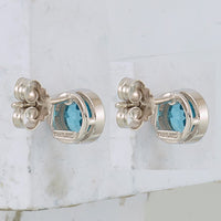 Sterling Silver Rhodium-plated Blue Topaz Circle Stud Earrings